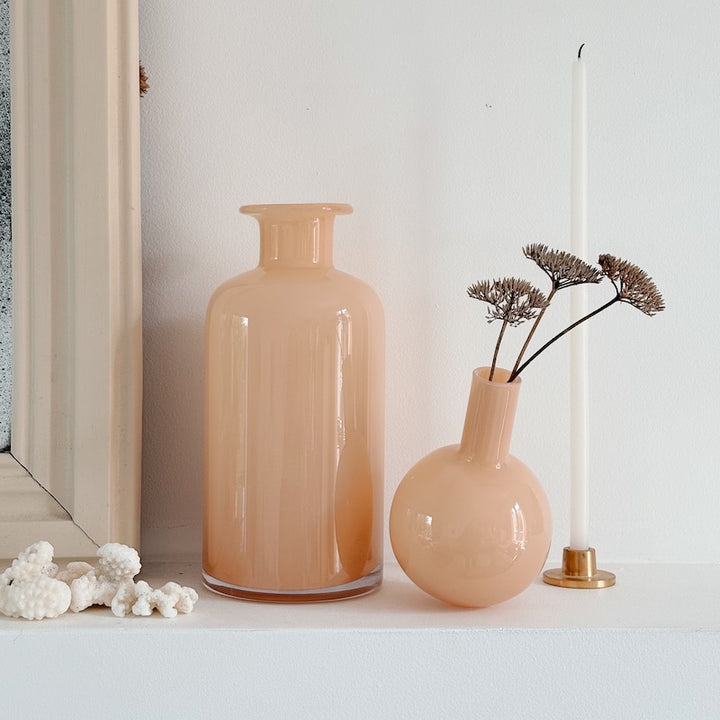 Bottle with rosé champagne glass stopper