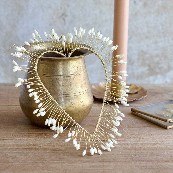 Golden heart with seashells