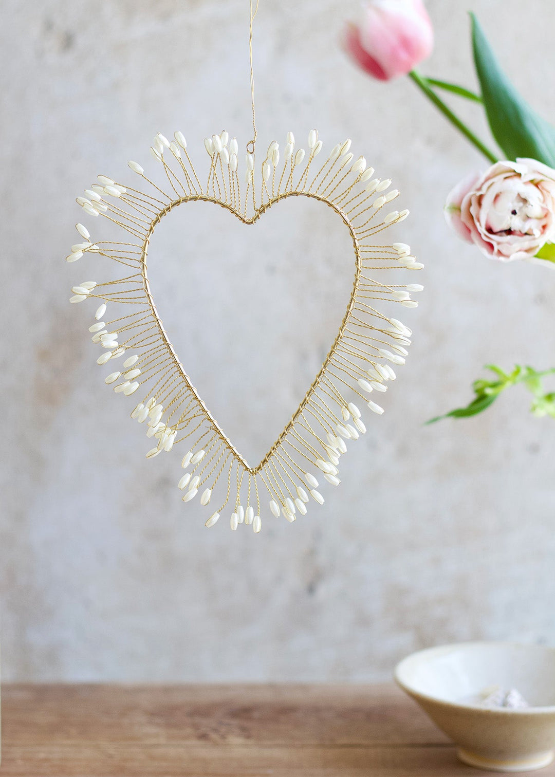 Golden heart with seashells