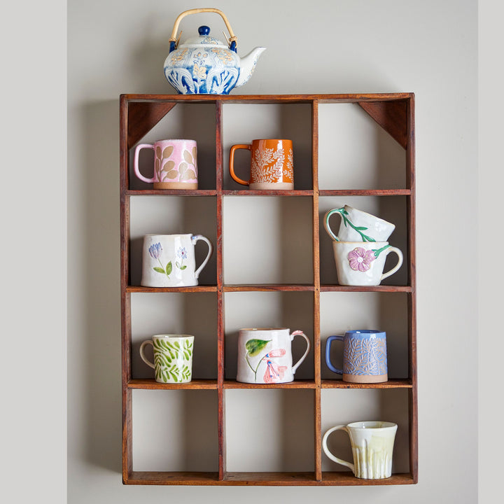 Wooden wall-mounted compartmentalized shelf