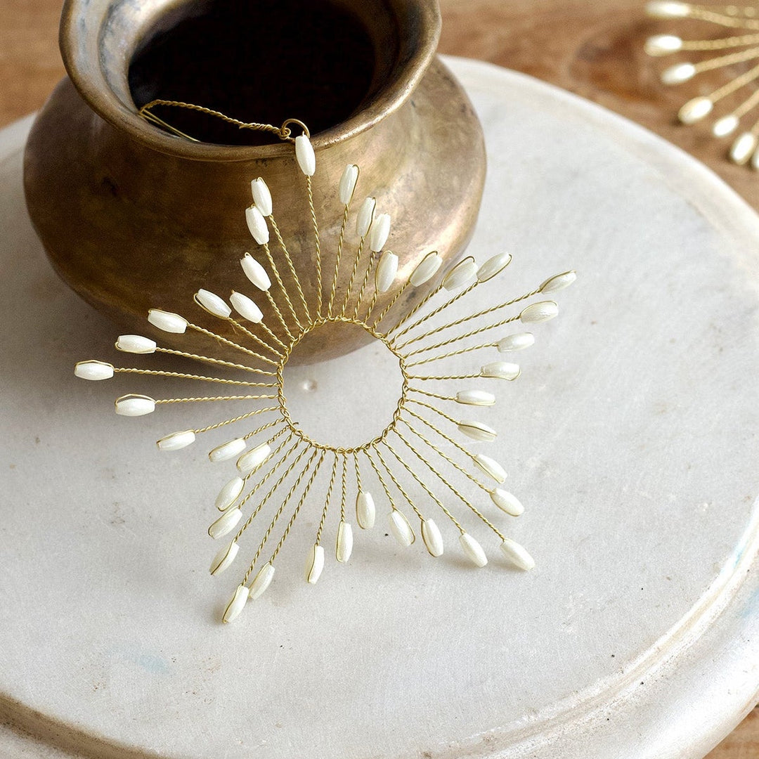 Etoile en laiton et coquillages