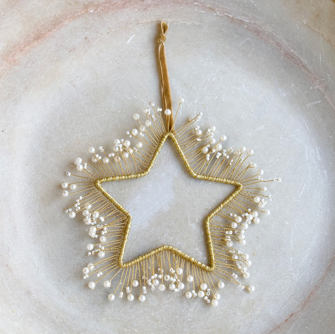 Etoile en laiton et perles