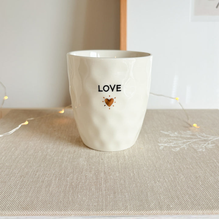 Mug with gold heart design and "Love" inscription