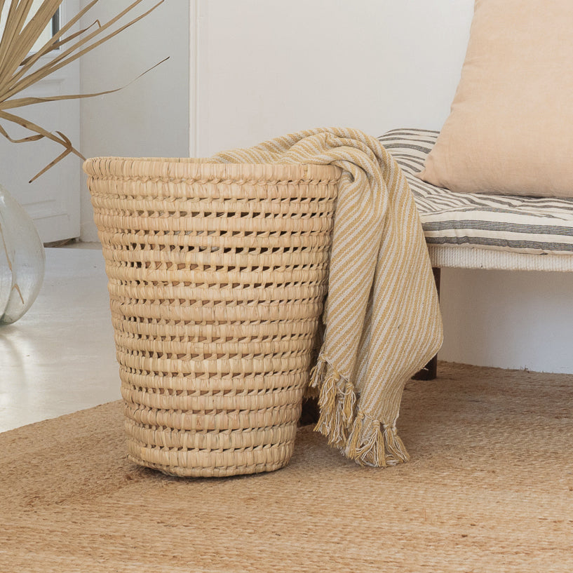 Conical palm leaf basket