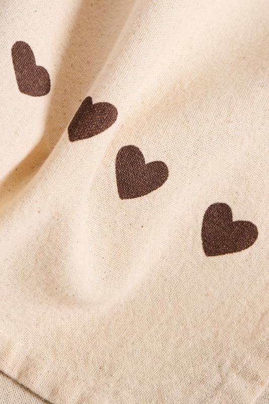 Cotton tea towel with mocha hearts