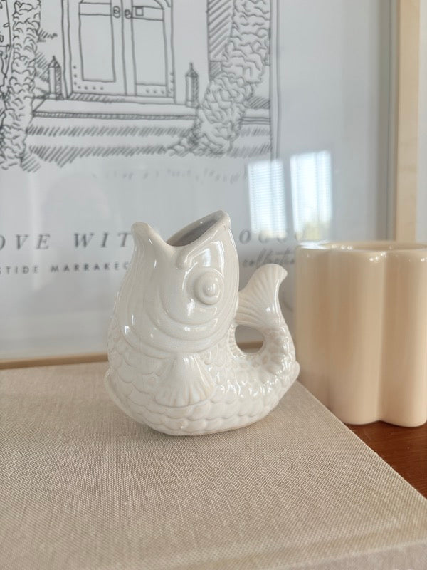 Small white ceramic fish vase
