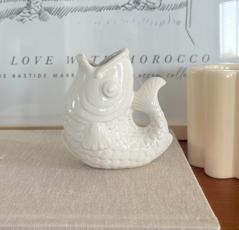 Small white ceramic fish vase